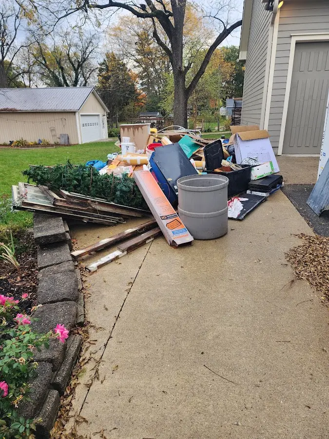 Dumpster being loaded with debris for Residential Dumpster Rental in Armona